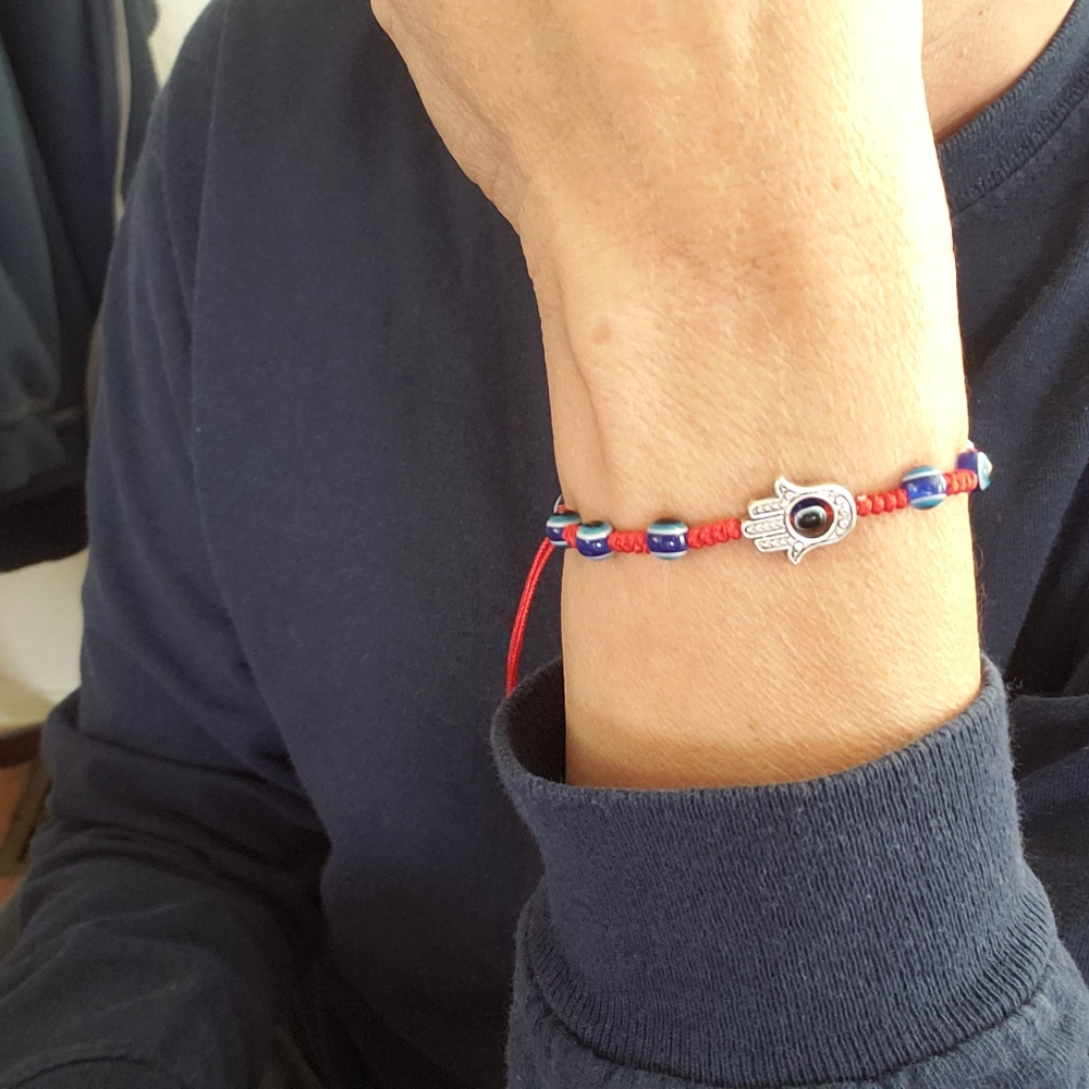 Hamsa hand and evil eye bracelet. Prosperity/Protection ancient symbols.